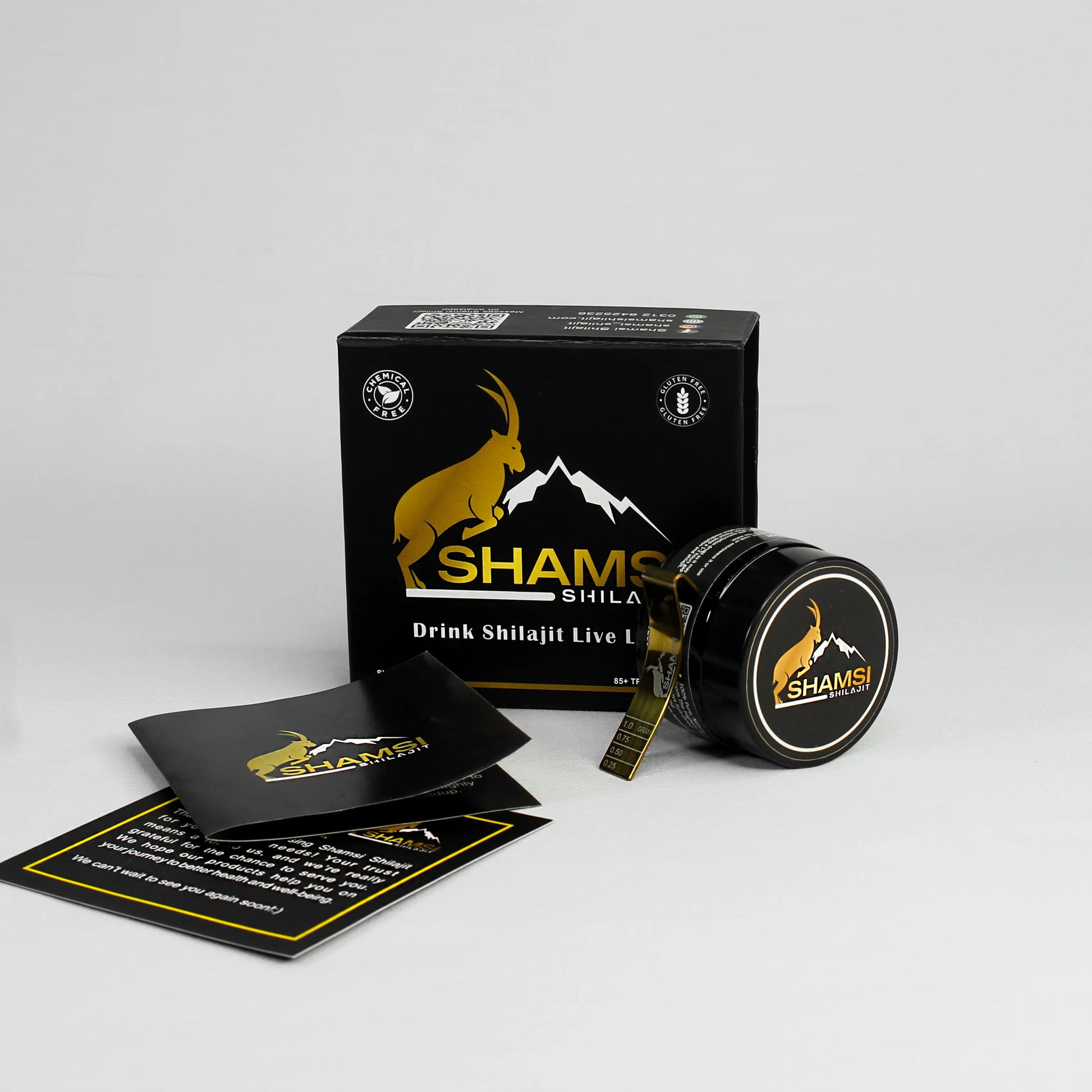 Shamsi Shilajit jar with golden spoon – premium Himalayan resin from Gilgit Baltistan.